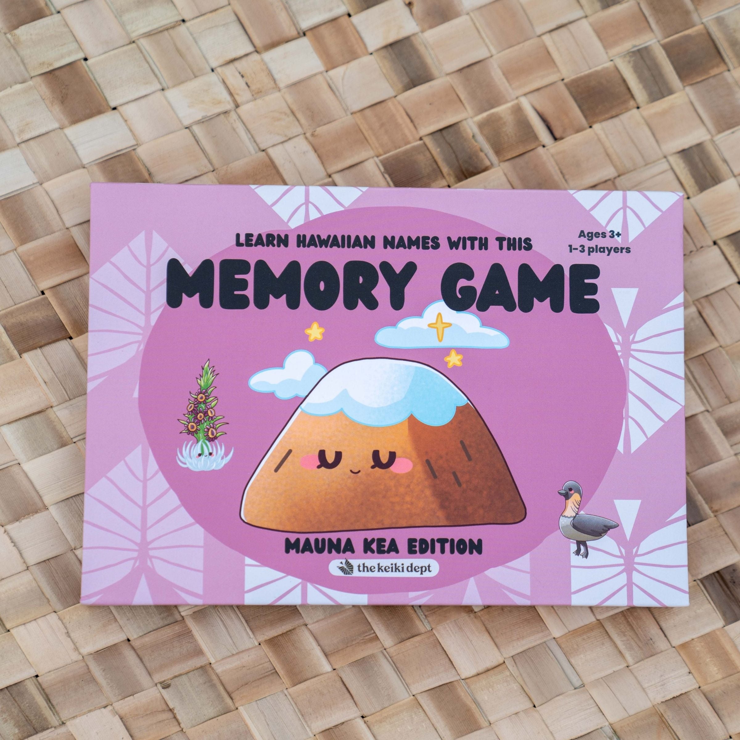 Memory game packaging with a pink background and cartoon illustration on a woven surface